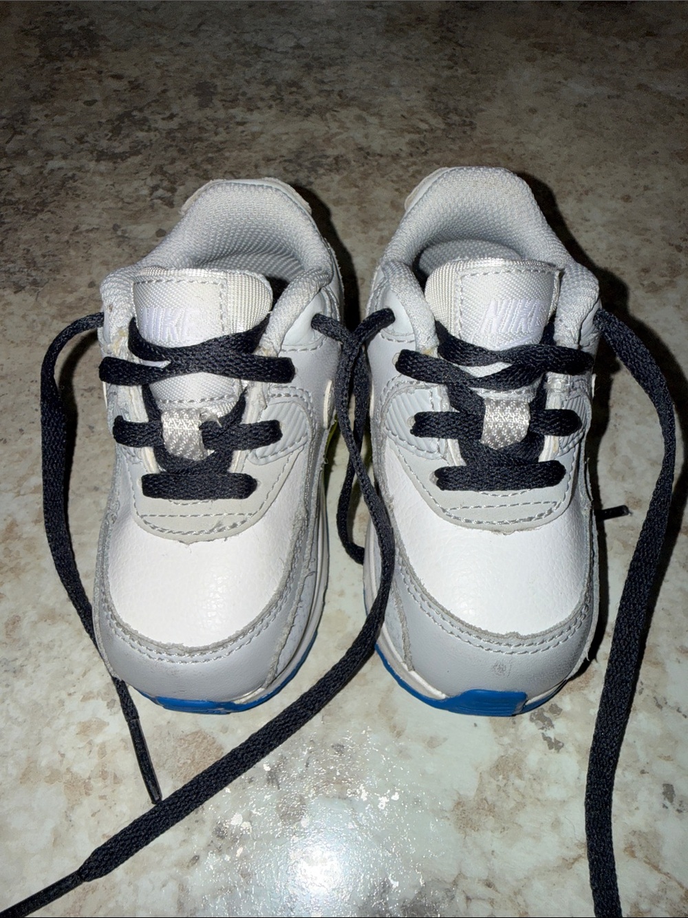 Nike Kids White Sneakers with Black Laces and Blue Accents